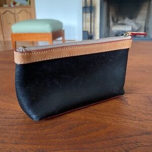 Dooney & Bourke cosmetic bag- black and tan leather, red details